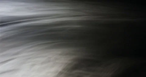 Clouds of smoke floating slowly in space on the left side, black background, 4k Stock Footage 82067821