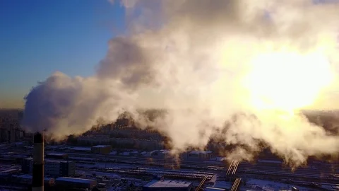 Clouds of smoke fly from flue gas stack of heating plant, aerial shot Stock Footage 85115820