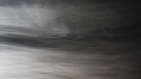 Clouds of smoke moving slowly to the left side, black background, 4k Stock Footage 82074330
