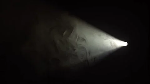 Clouds of smoke in a narrow beam of light Stock Footage 214094862