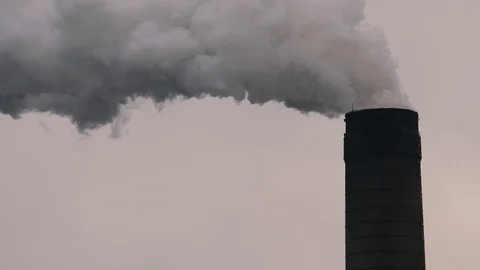 Clouds of smoke pouring out of a brick built chimney stack. Stock Footage 125803504