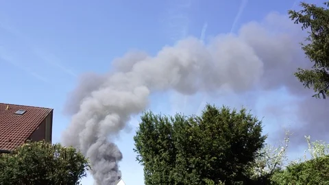 Clouds of Smoke Rise into the Sky 動画素材 97769311