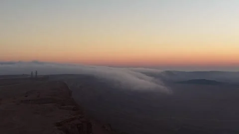 Clouds spill into Israel's Ramon Crater in rare inversion phenomenon, Mitzpe Ram Stock Footage 344801419