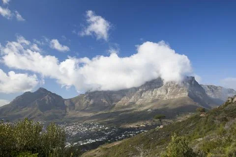 Clouds spilling over Table Mountain in Cape Town. Stock Photos