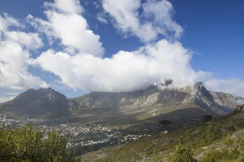 Clouds spilling over Table Mountain in Cape Town. Stock Photos