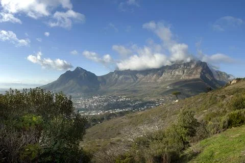 Clouds spilling over Table Mountain in Cape Town. Stock Photos