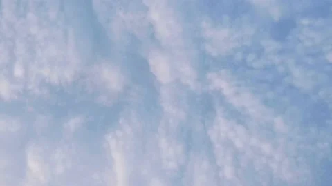 Clouds spinning in a blue sky Stock Footage 159586532