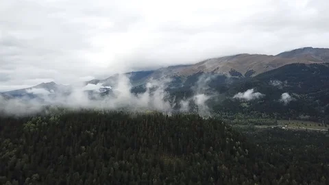 Clouds spread over the mountains of Arkhyz Stock Footage 98084462