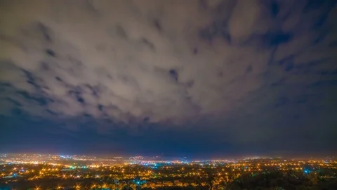 Clouds stream on the background of the city. day to night transition. time lapse Stock-Footage 77697226