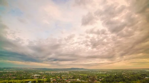 The clouds stream over the city. day to night transition. tim Video stock 77697198