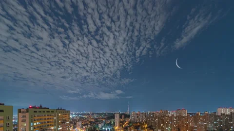 The clouds stream over the night megalopolis. time lapse Stock Footage 137769660