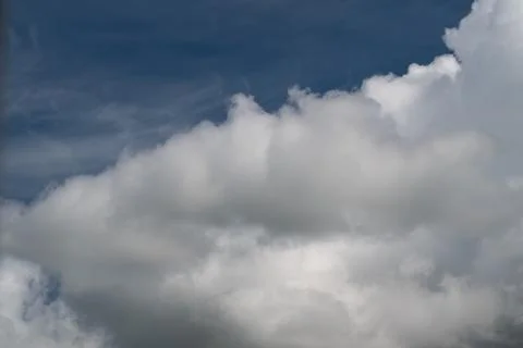 Clouds stretch wide. Delicate sky patterns float peacefully. Feathery cloud.. Stock Photos
