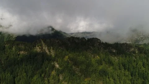 Clouds stuck over the mountain and forest Stock Footage 108029676