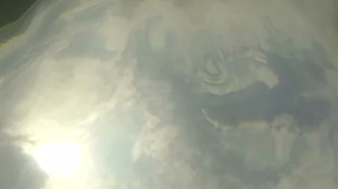 Clouds, sun and sky seen from undewater Stock Footage 36584991