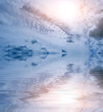 Clouds sun ocean Stock Photos