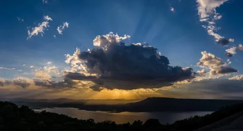 Clouds sun ray Stock Photos