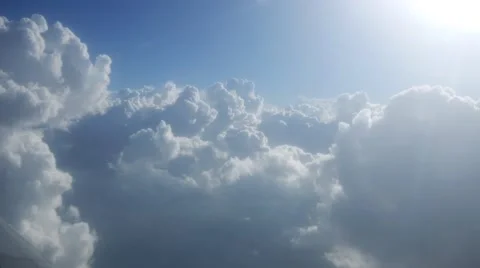 Clouds from sun rays aerial cumulus blue sky white big formations storm 4k Stock Footage 57254294