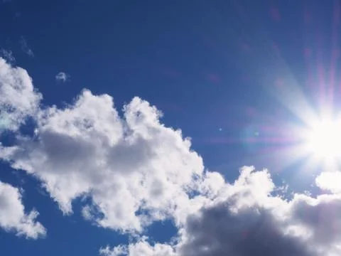 Clouds with Sunburst Stock Photos