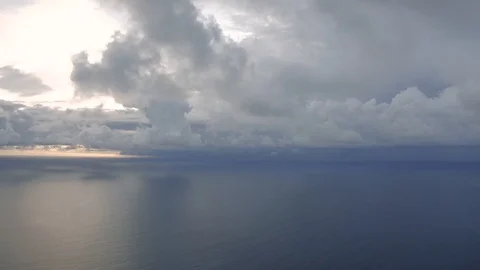 Clouds in sunlight over the Ocean next to Bali Island 4K Drone shot Stock Footage 119395800