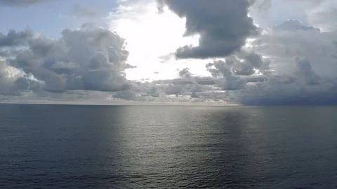 Clouds in sunlights over the Ocean next to Bali Island 4K Drone shot Stock Footage 119520811