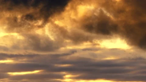 Clouds at sunrise with dark smoke - sky in Real Time - Cloudscape - background Stock Footage 143244031