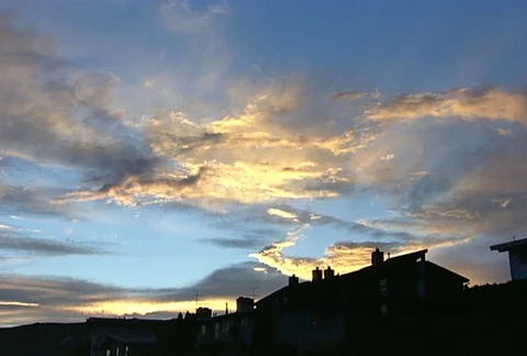 Clouds at sunset houses in FG Stock Footage 98072191