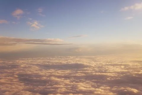 Clouds at sunset from iljuminatora plane sky Sun travel 스톡 사진