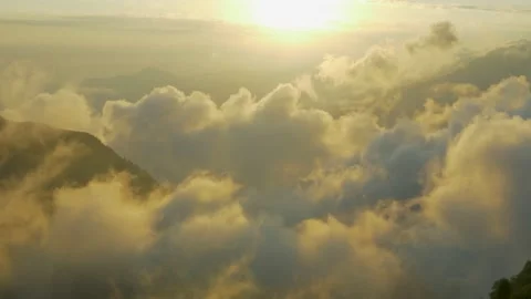 Clouds in the sunset light ib the high mountains Stock Footage 135786386