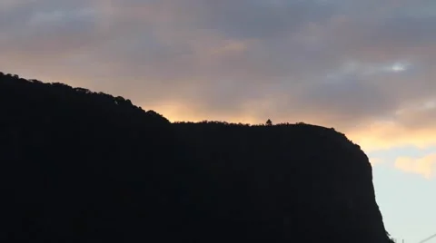 Clouds at sunset over the mountain sped up Stock-Footage 50081509