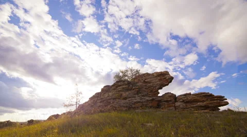 Clouds sunset over rock Stock Footage 47084594