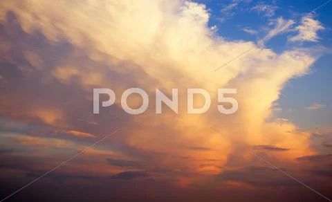 Clouds at sunset Stock Photos