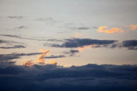 Clouds at sunset Stock Photos