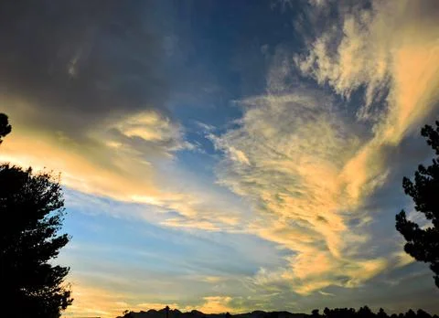 Clouds at sunset Stock Photos