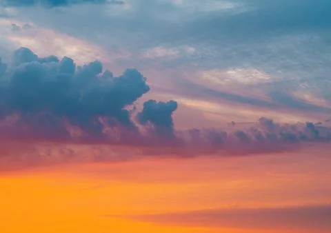 Clouds in the sunset sky. Dramatic cloudscape background. 写真素材