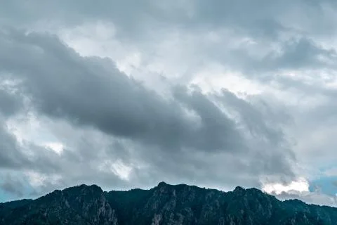 Clouds in the sunset sky over a mountain of Lake Maggiore (Italy) Stock Photos