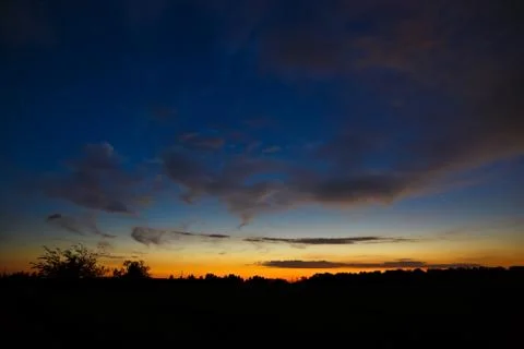 Clouds at sunset in the sky. Stock Photos