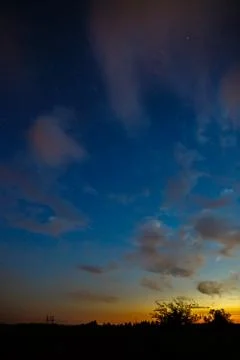 Clouds at sunset in the sky. Stock Photos