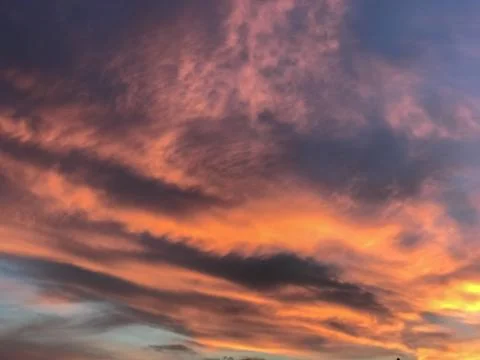 Clouds in the sunset sky Stock Photos