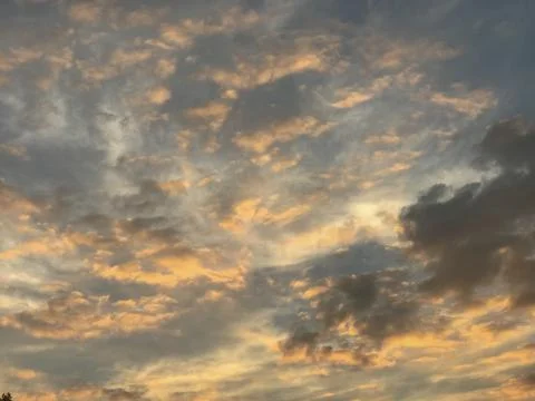 Clouds in the sunset sky Stock Photos