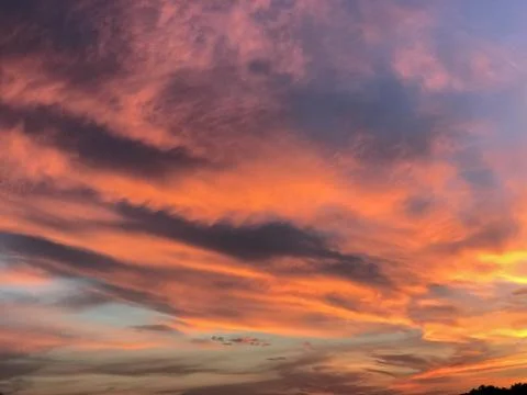 Clouds in the sunset sky Stock Photos