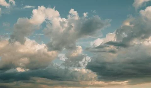 Clouds at sunset, summer sky background, evening cloudscape Stock Photos