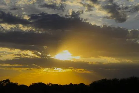 Clouds at Sunset with Sun 库存照片