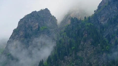 Clouds surround the peaks Stock Footage 314640297