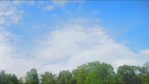 Clouds swim over the park timelapse 스톡 동영상 78015537