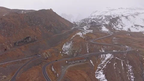 Clouds swirl over Stelvio's high alpine roads, fall view, Italy. Stock Footage 321545248