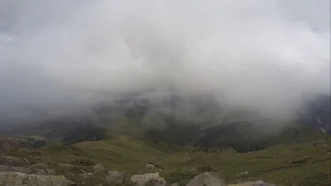 Clouds Swirling across Mountains Stock Footage