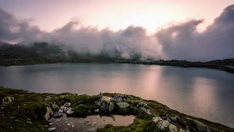 Clouds taking over Totensee in Grimsel, Grimselpass time lapse Stock Footage 119057575