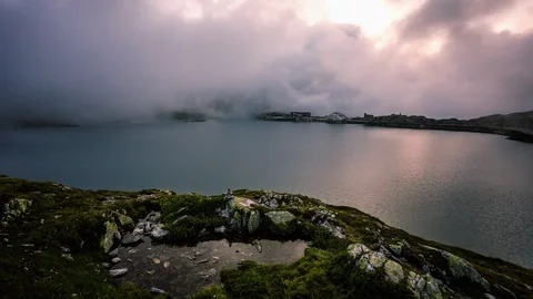 Clouds taking over Totensee in Grimsel, Grimselpass time lapse Stock Footage 119057616