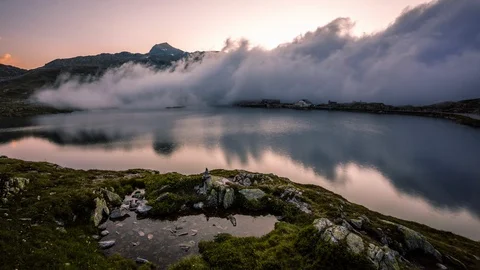 Clouds taking over Totensee in Grimsel, Grimselpass time lapse Stock Footage 119057633