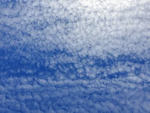 Clouds texture pattern in sunny sky background Stock Photos